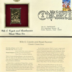 May include: A gold-colored stamp featuring Wile E. Coyote and Road Runner, the classic cartoon duo. The stamp is surrounded by a red border and a white background. The text "Wile E. Coyote & Road Runner" is printed in black on the stamp. The text "First Day of Issue" is printed in black on the white background.