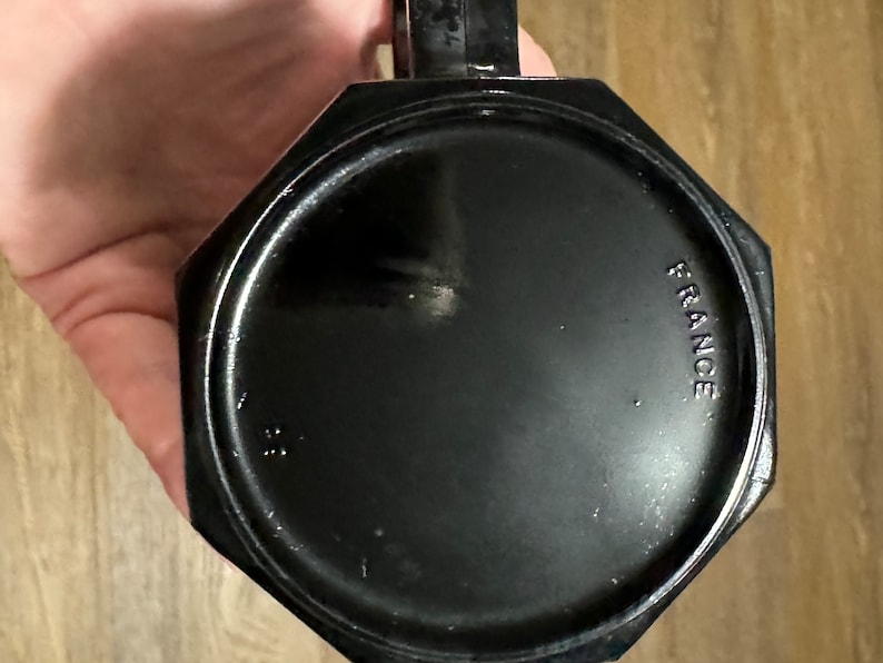 May include: Black octagonal mug with the word "FRANCE" printed on the bottom.