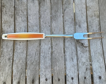 Vintage EKCO-vleesvork: verchroomd serveergerei met oranje handvat