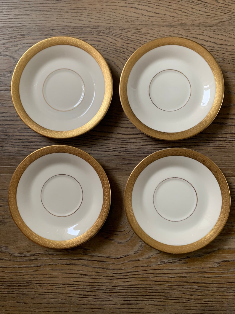 Set of 4 Old Ivory Syracuse China Bracelet Design Saucers