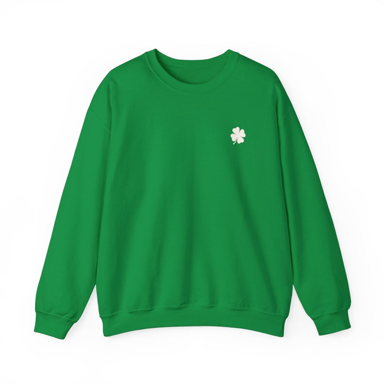 May include: A bright green sweatshirt with a small white four-leaf clover embroidered on the left chest. The long-sleeved crew neck top is made of a soft material and is suitable for casual wear. The design is simple and festive.