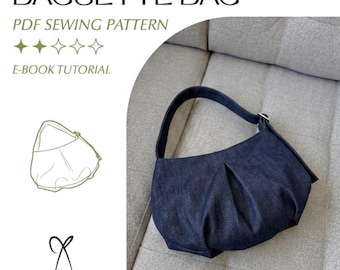 May include: A dark blue denim baguette bag with a single shoulder strap and pleated front detailing. The image includes text reading BAGUETTE BAG, PDF SEWING PATTERN, E-BOOK TUTORIAL, and cut a sew simply, alongside a line drawing of the bag.