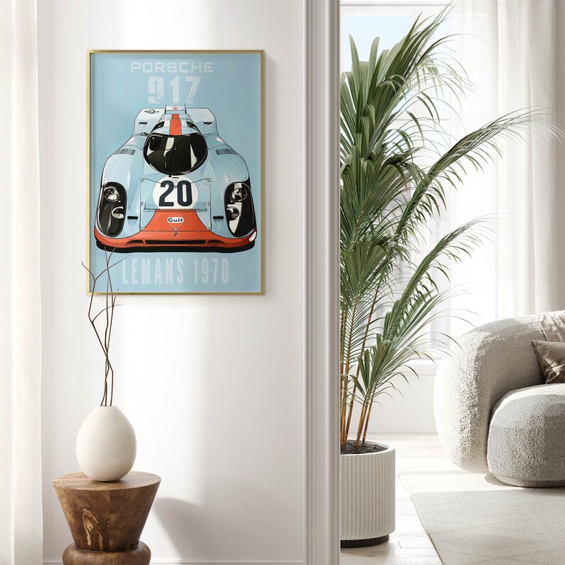 May include: A vintage poster featuring a blue and red Porsche 917 race car with the number 20 and the words "Gulf" and "Le Mans 1970".