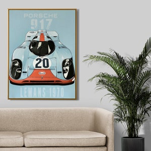 May include: A blue and white vintage poster featuring a blue Porsche 917 race car with the number 20 and the Gulf logo. The poster reads "Porsche 917 Le Mans 1970".