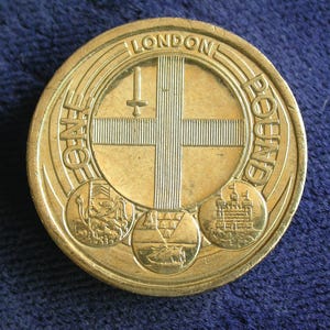 British 2010 London Almost Uncirculated One Pound Coin – Frequently Described as “One of Rarest Pound Coins”