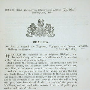 May include: A vintage document page with text and a detailed emblem. The text includes the title "The Harrow, Edgware, and London Railway Act, 1869." The emblem features a crest with lions and a unicorn. The document is aged with a light blue background.