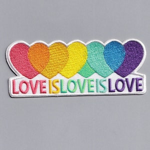 May include: An embroidered patch with a rainbow of hearts and the text "LOVE IS LOVE IS LOVE".