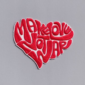 May include: Red embroidered patch in the shape of a heart with the text "Make Love Not War" inside.
