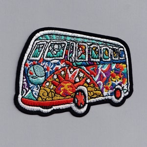 May include: A colorful embroidered patch of a psychedelic van with a black outline. The van is decorated with a variety of patterns and colors, including red, yellow, blue, green, and purple.