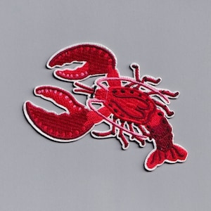 May include: Red embroidered lobster patch with white outline.