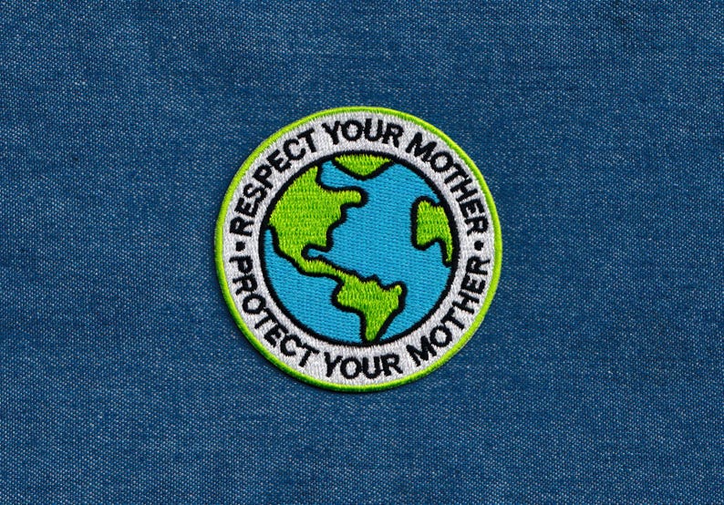 May include: A white, green and blue embroidered patch with the text "Protect Your Mother - Respect Your Mother" surrounding a blue and green globe.