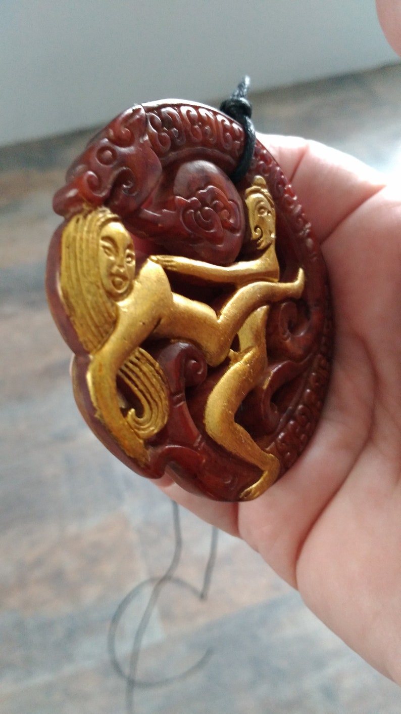 with adjustable necklace. Jade man and woman pendant