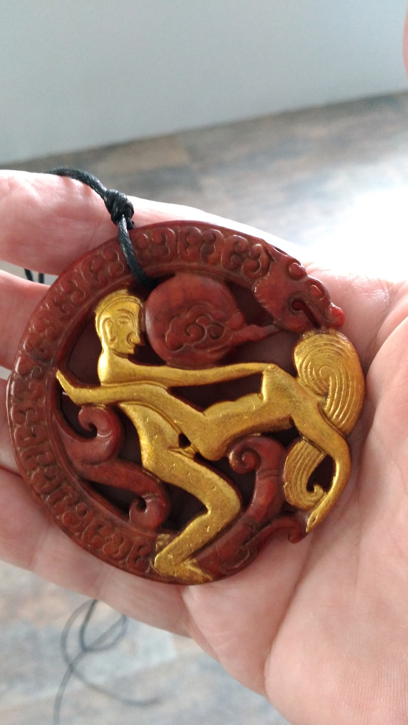 with adjustable necklace. Jade man and woman pendant