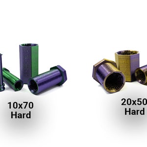 May include: An assortment of metallic, hexagonal-shaped objects in green, purple, and gold. The text "10x70 Hard" and "20x50 Hard" are displayed below the objects. The objects are cylindrical and have a textured surface.