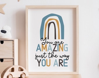 May include: A framed print with a rainbow design in shades of blue, brown, and yellow. The text "You are AMAZING just the way YOU ARE" is written in black below the rainbow.