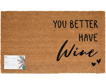 May include: A brown coir doormat with the text "You better have wine" in black lettering. Two small black hearts are on the right side of the mat.