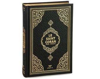 May include: A black leather-bound book with gold accents and intricate designs. The title "LE SAINT CORAN" is written in gold lettering on the front cover. The book is in Arabic and French.