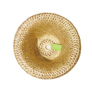 May include: A woven bamboo lampshade with a spiral design. The lampshade is a light tan color and has a circular shape. A green tag with the word "CRAFTIV" is attached to the lampshade.