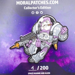 May include: A purple and gray space marine character with a skull-patterned suit, holding a gun and smoking a cigar. The character is wearing a helmet and has a determined expression. The image is part of a collector's edition series and is numbered 1/200. The text "SPACE MARINE AND ALIEN" is also visible.