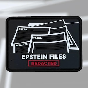 May include: A black rectangular patch with white text and graphics. The patch features the words "EPSTEIN FILES" and "REDACTED" in a red rectangle. White file graphics are also present, with "FILE NO." text.