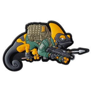 May include: A black, green and yellow cartoon chameleon wearing a green tactical vest and a brown backpack, holding a black rifle and a spear. The chameleon is wearing a black helmet with a white eye.