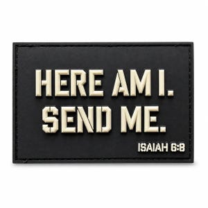 May include: A rectangular black patch with raised off-white lettering that reads "HERE AM I. SEND ME." and "ISAIAH 6:8" in the bottom right corner. The patch features a clean, bold font style with a matte finish and stitched edges.