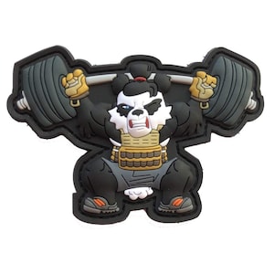May include: A black, white, and gray patch featuring a cartoon panda lifting a barbell overhead. The panda is wearing a sumo wrestler outfit with yellow gloves and orange-accented shoes. The barbell has gray weights.