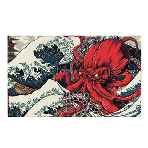Puede incluir: Un paño decorativo rectangular con un vibrante pulpo rojo con ojos amarillos, sobre un fondo de olas oceánicas estilizadas en tonos azules y blancos. Se utiliza un estilo de arte japonés tradicional.