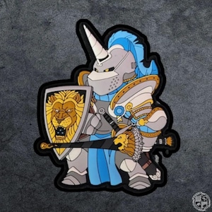 May include: A cartoon patch depicting a knight with a unicorn horn helmet, holding a shield with a lion's head and a sword. The knight is in silver armour with blue and gold accents. The patch has a black border.