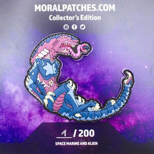 May include: A blue and pink alien creature with a long tongue, wearing a space marine suit, is depicted on a patch. The patch is a collector's edition and is numbered 1/200. The text "Space Marine and Alien" is printed below the patch.