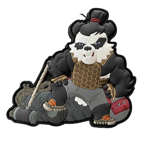 May include: A black, white, and tan panda bear character patch with a muscular build, wearing a tan and brown chest plate and gray shorts. The panda is leaning on a tire and holding a hammer. The patch has orange and gray accents.