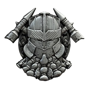 May include: A detailed, silver-colored Viking helmet design with a full beard and crossed axes. The helmet features intricate patterns and a stern face, with axes on either side. The design is likely for a pin, pendant, or emblem.