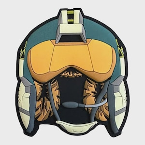 Könnte beinhalten: Ein Aufnäher mit einer stilisierten Darstellung eines futuristischen Helms. Der Helm hat eine teal- und gelbliche Farbgebung mit einem schwarzen Hintergrund. Das Design umfasst ein Visier, Kommunikationselemente und detaillierte Innenausstattung.