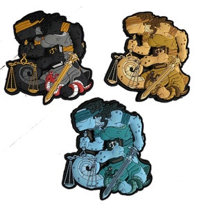 May include: Three colorful Justice-themed patches. One is black with gold accents, a sword, scales, and a red snake. Another is tan with gold accents. The third is blue with a blindfold, scales, and a sword.