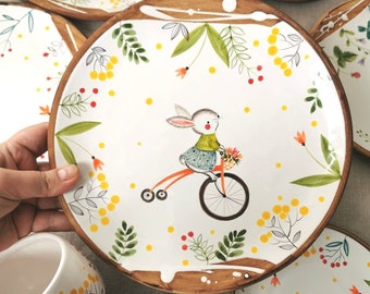 Nice gift for birthday party for little girl.  Bowl for soup or porridge and plate with bunny on bike and spoon (gift) for set (bowl+plate)