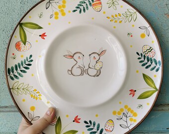 Big dish for serving Happy Easter table with eggs by Osoka Art ceramics. Cute bunnies looking for eggs