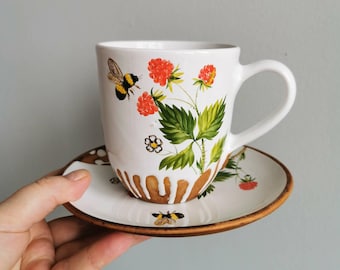 Hand made a mug and saucer- painted. The sunny pattern with bumblebee will create a joyful mood in any bad weather your kitchen