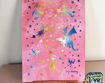 May include: Pink artwork with the words "Night flight" and illustrations of witches, dragons, cats, and stars in iridescent colors. Signed by Lucy Stuteley.