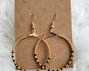 Hand-beaded black and gold hoops