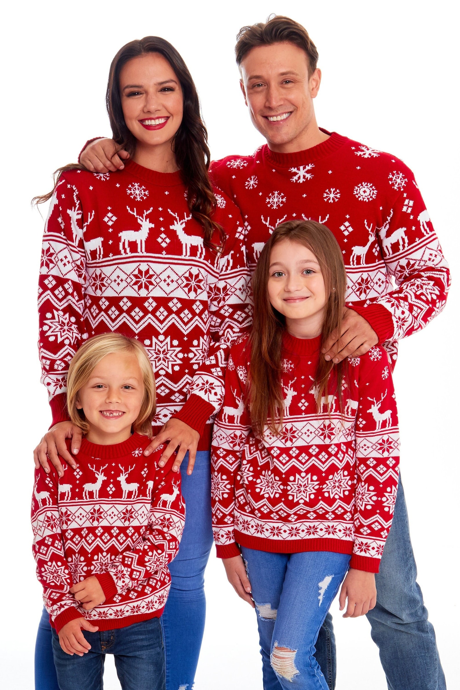 Matching red plaid Christmas photo outfits family wearing coordinating sweaters