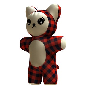 May include: A red and black plaid plush toy shaped like a cat. The toy has a white face with black eyes and a black nose.