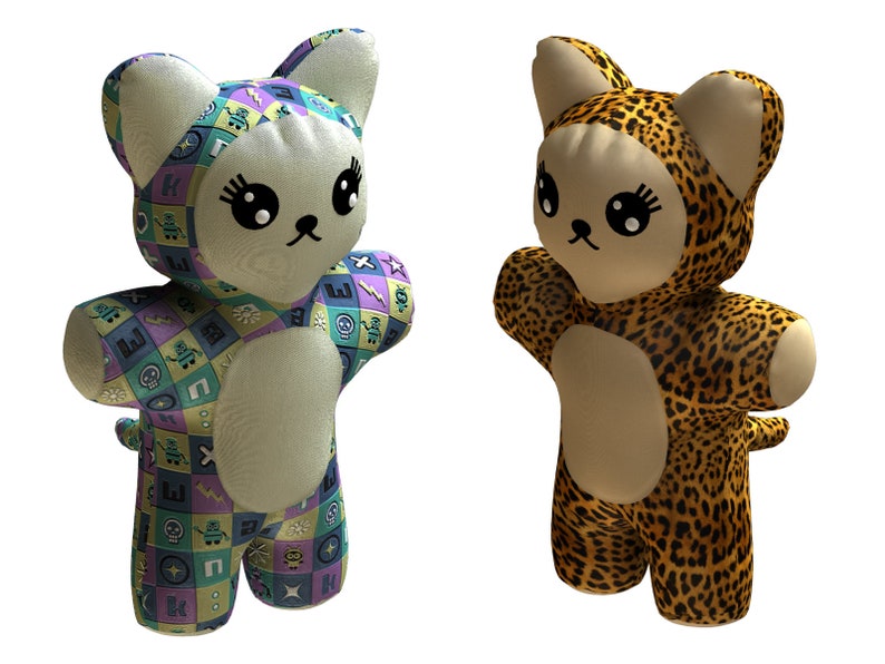 May include: Two plush cat toys, one with a geometric pattern and the other with a leopard print. Both toys have large eyes and a cute expression.