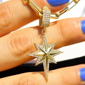 Stellar Radiance: 14K Gold Pole Star Pendant Necklace with Diamond Accents 2.75gr.