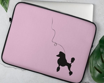 May include: A pink laptop sleeve with a black silhouette of a poodle with a curly tail.