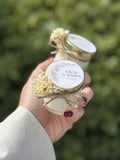 Personalized wedding candle - Guest gifts with golden lid and dried flowers product logo