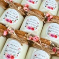 Personalized candle for baby shower and gender reveal gifts with dried flowers product logo