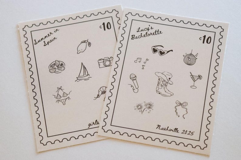 May include: Two cream-colored cards with black line drawings of travel and party-themed icons. One card says "Summer in Spain" and the other says "Lucy's Bachelorette Nashville 2025". Each card has a stamp-like border.