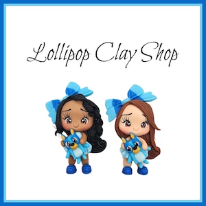 Girl holding blue dog for bows- Clay Bow Center clay doll, clay dolls, bow centerpieces, clay center for bows, bow center, puppy clays