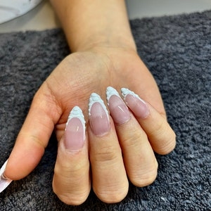 stiletto/almond white textured French tips