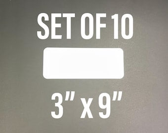 May include: Set of 10 white rectangular stickers, 3 inches by 9 inches. The stickers are blank and ready to be customized.